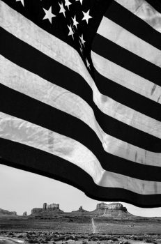 Terry LaRue, Flag over Monument Valley #1, Utah, Photograph, 24 × 20in. (61 × 50.8cm), Courtesy of the artist, Seattle, Washington